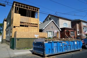 house project with dumpster in the front