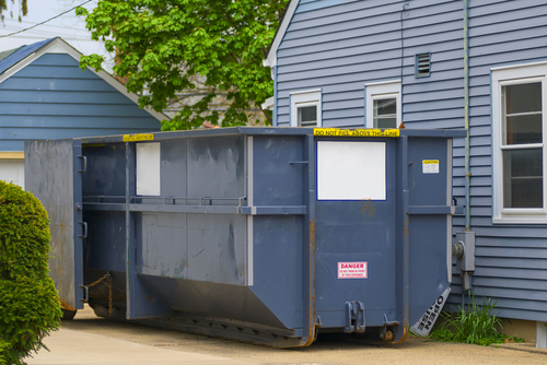 Dumpster Rental on the Side of a House